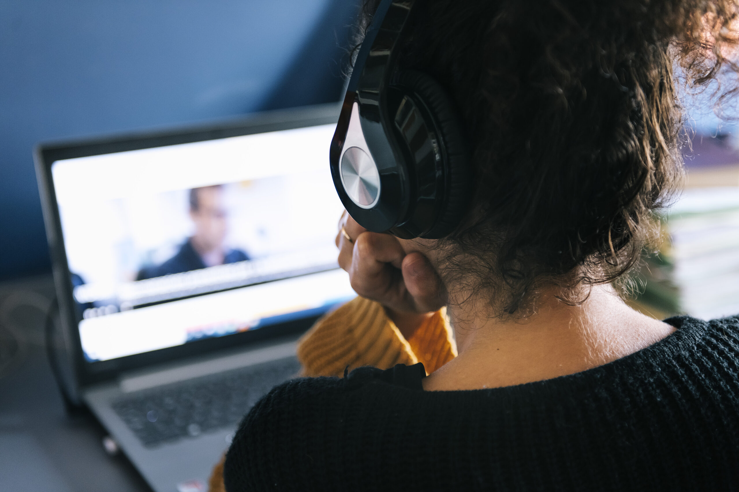 adult wearing headphones watching computer screen 2026 03 19 22 07 14 utc scaled