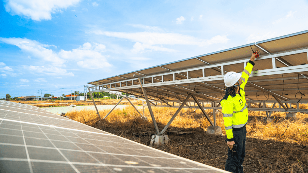 Technician inspecting solar panels to determine maintenance requirements and costs.